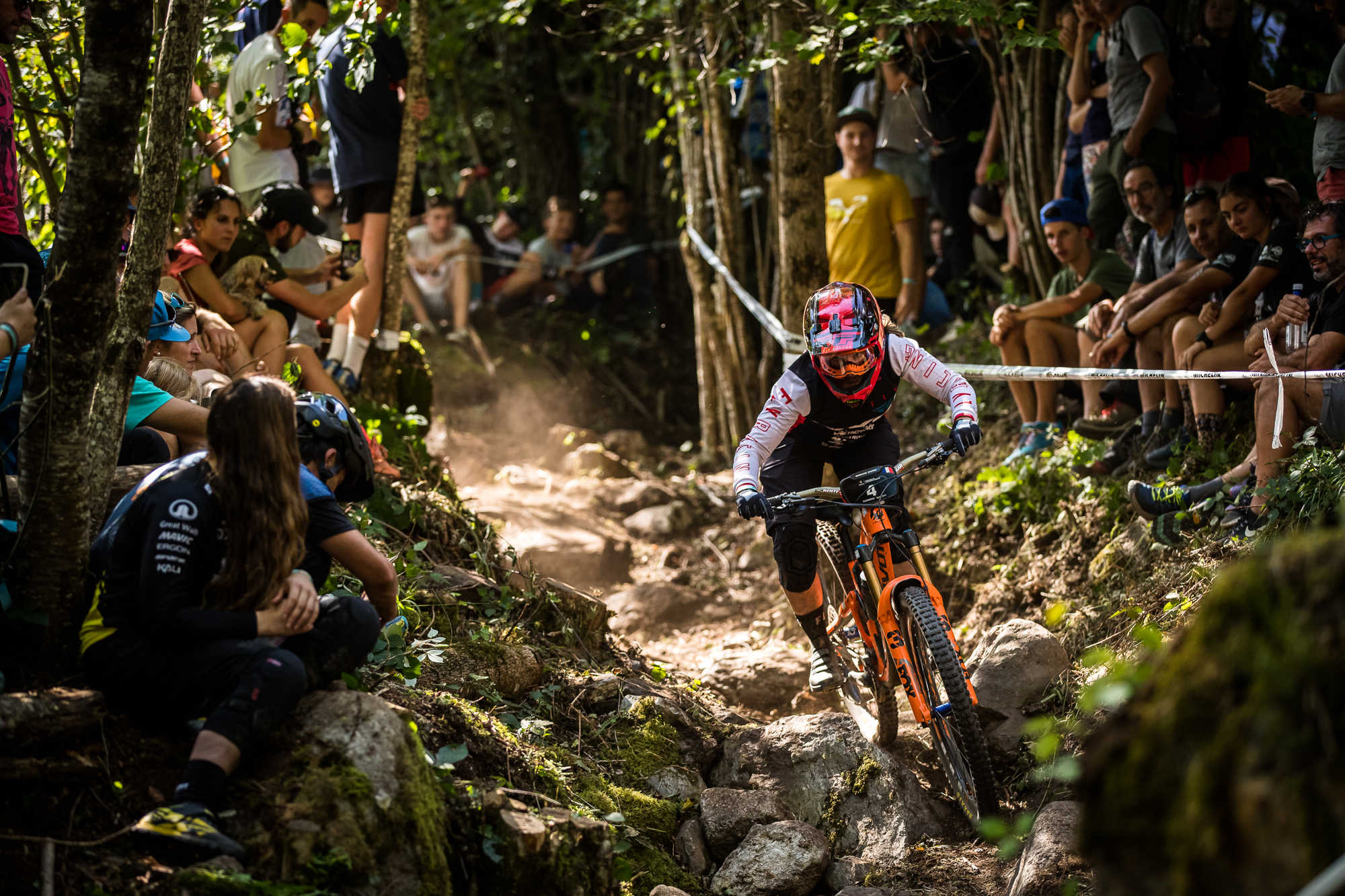 Pivot rider going through a rock garden