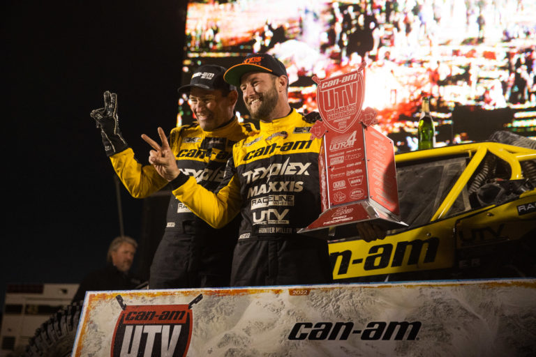 Hunter Miller and his Co-driver posing for photos on the podium at KOH