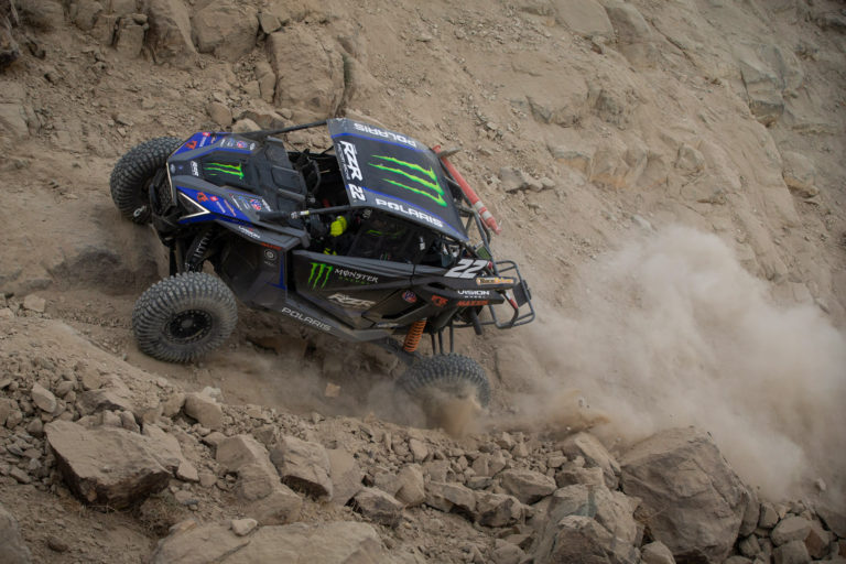 CJ Greaves blasting down a rock trail in his RZR SxS
