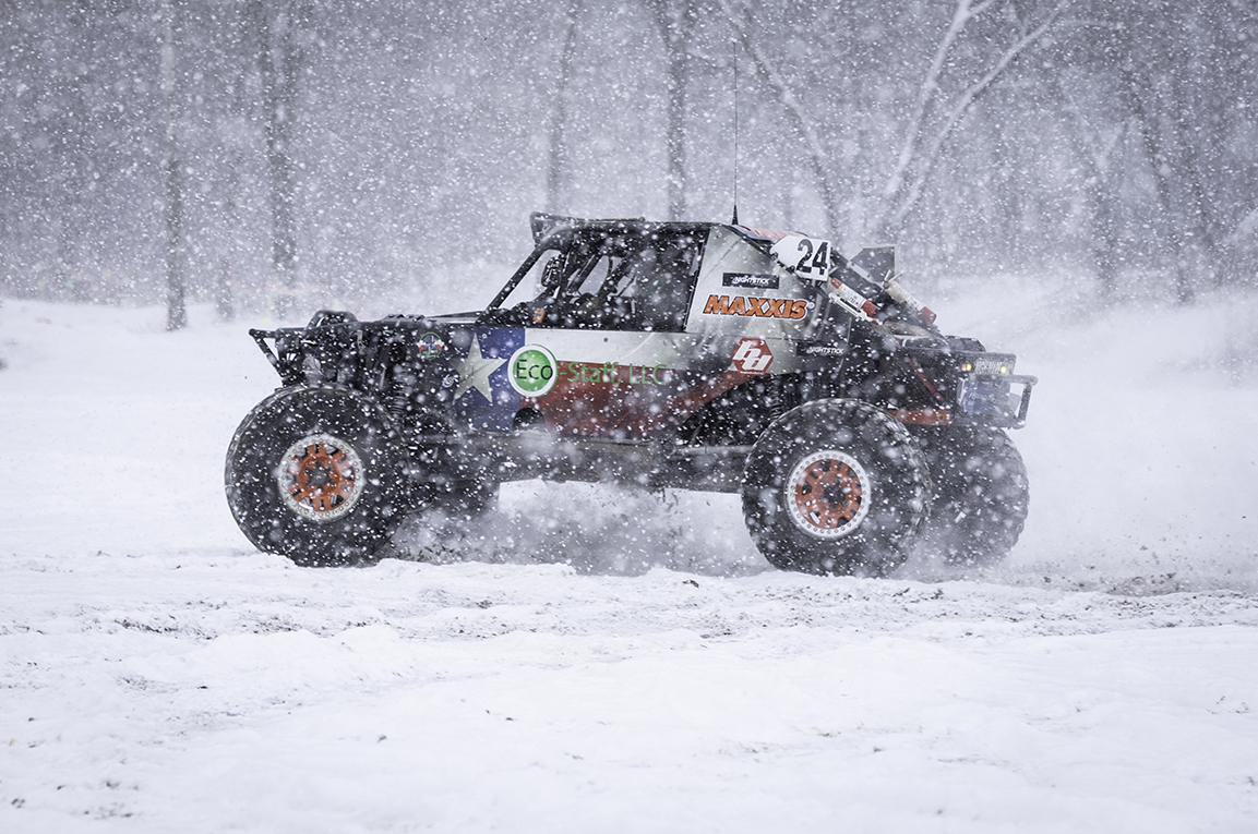 Truck racing through the snow