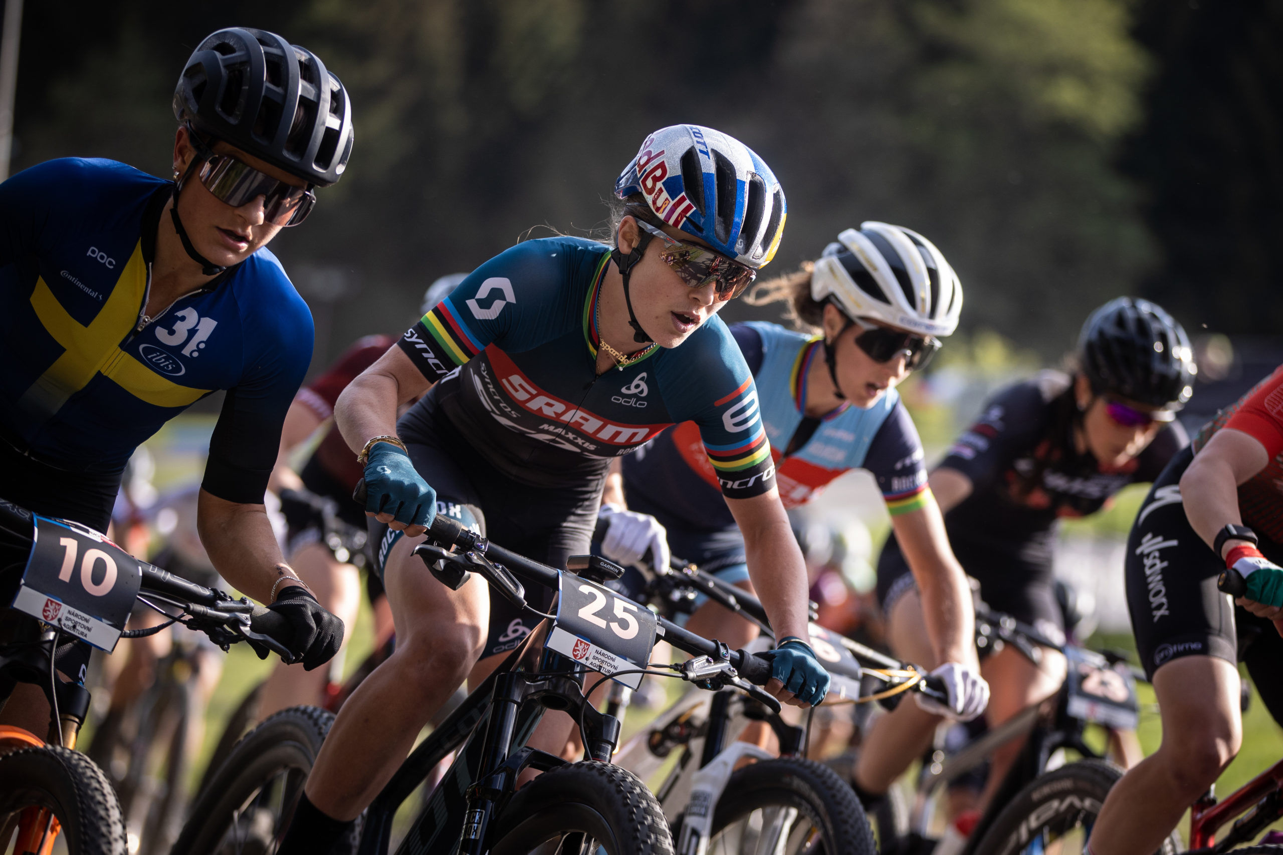 Kate Courtney leading a pack of riders in Nove Mesto