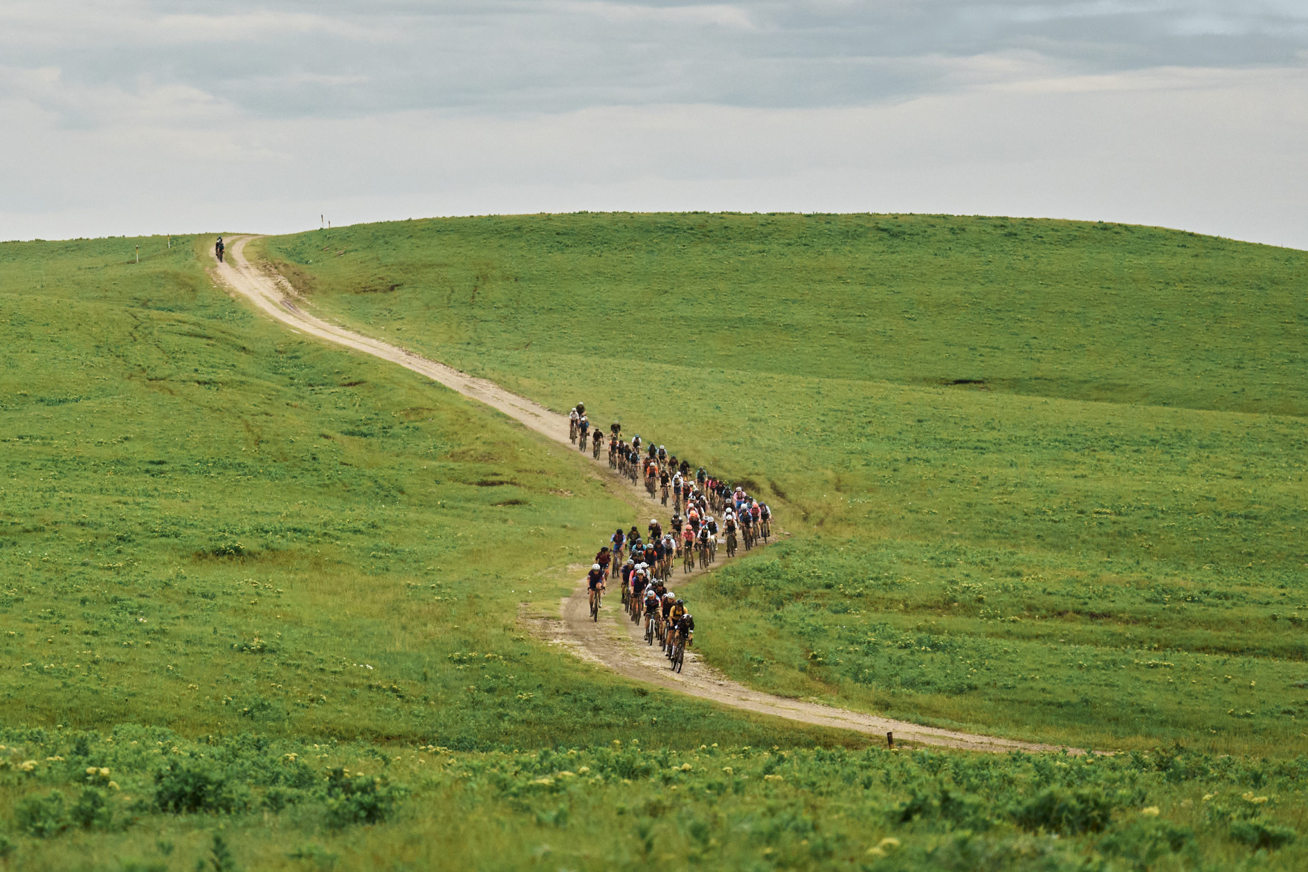 Riders racing up the Kansas Flint Hills