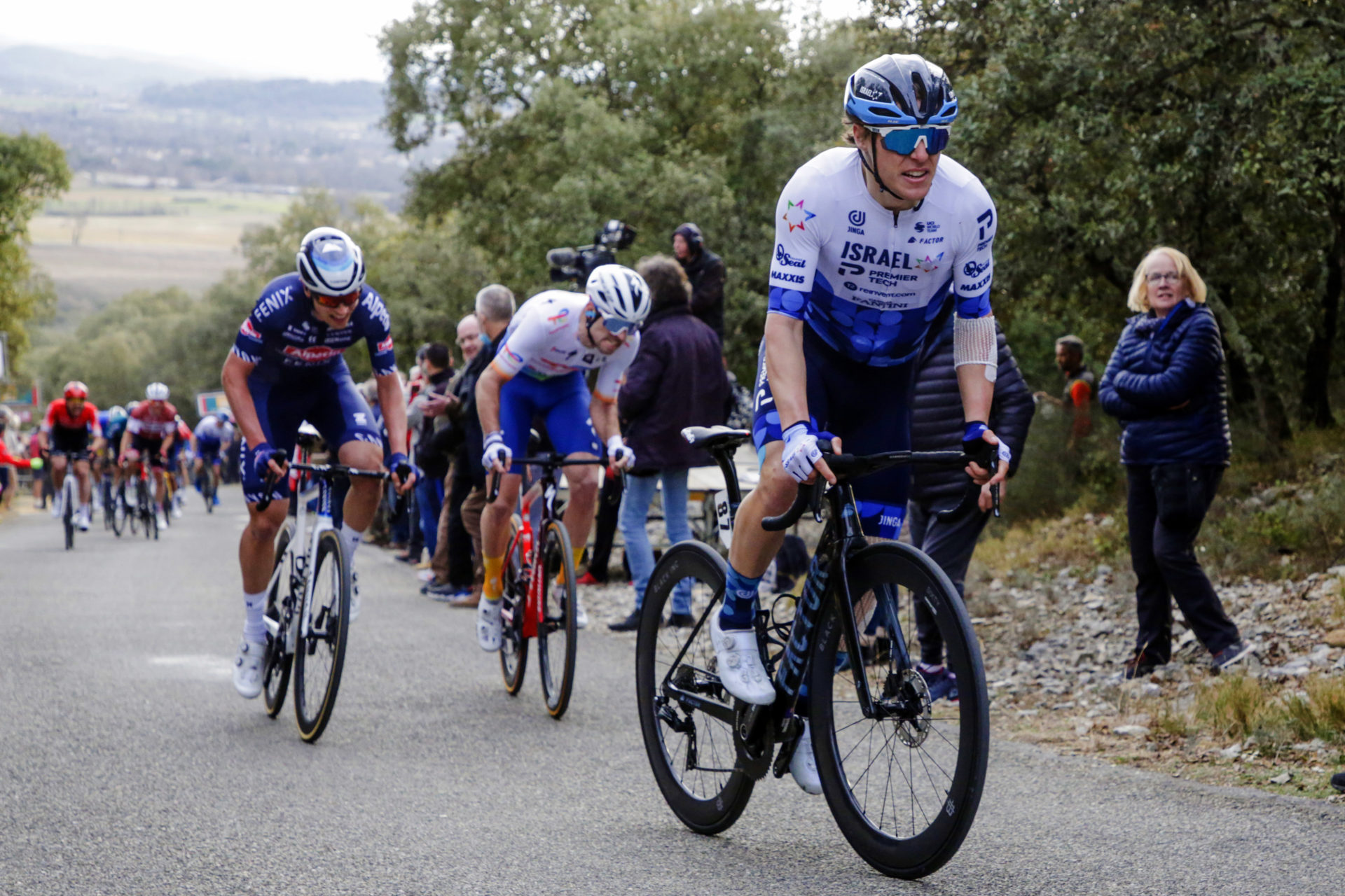 A road cyclist climbing a hill during a race