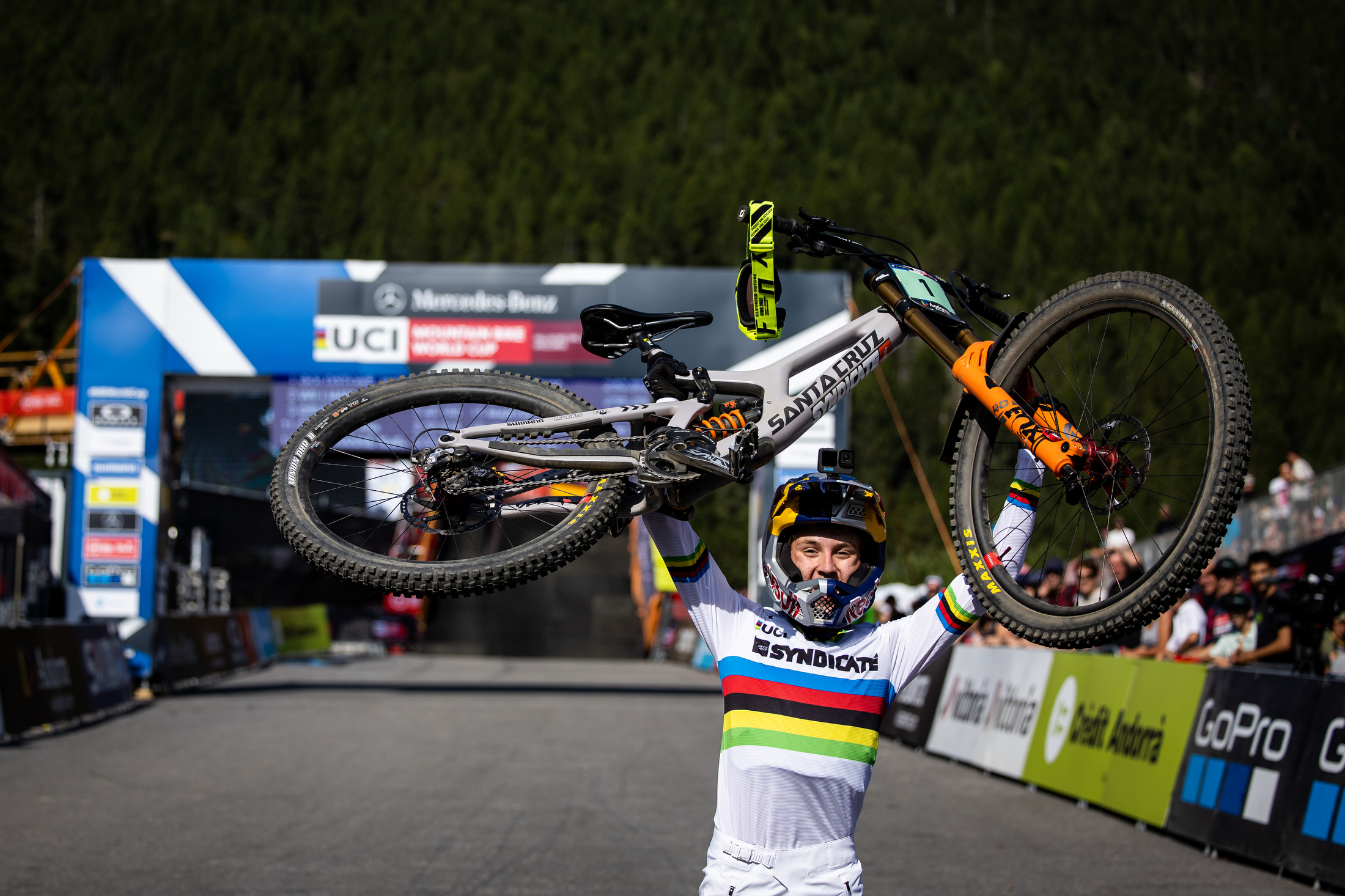 Jackson raising his bike above his head in Andorra