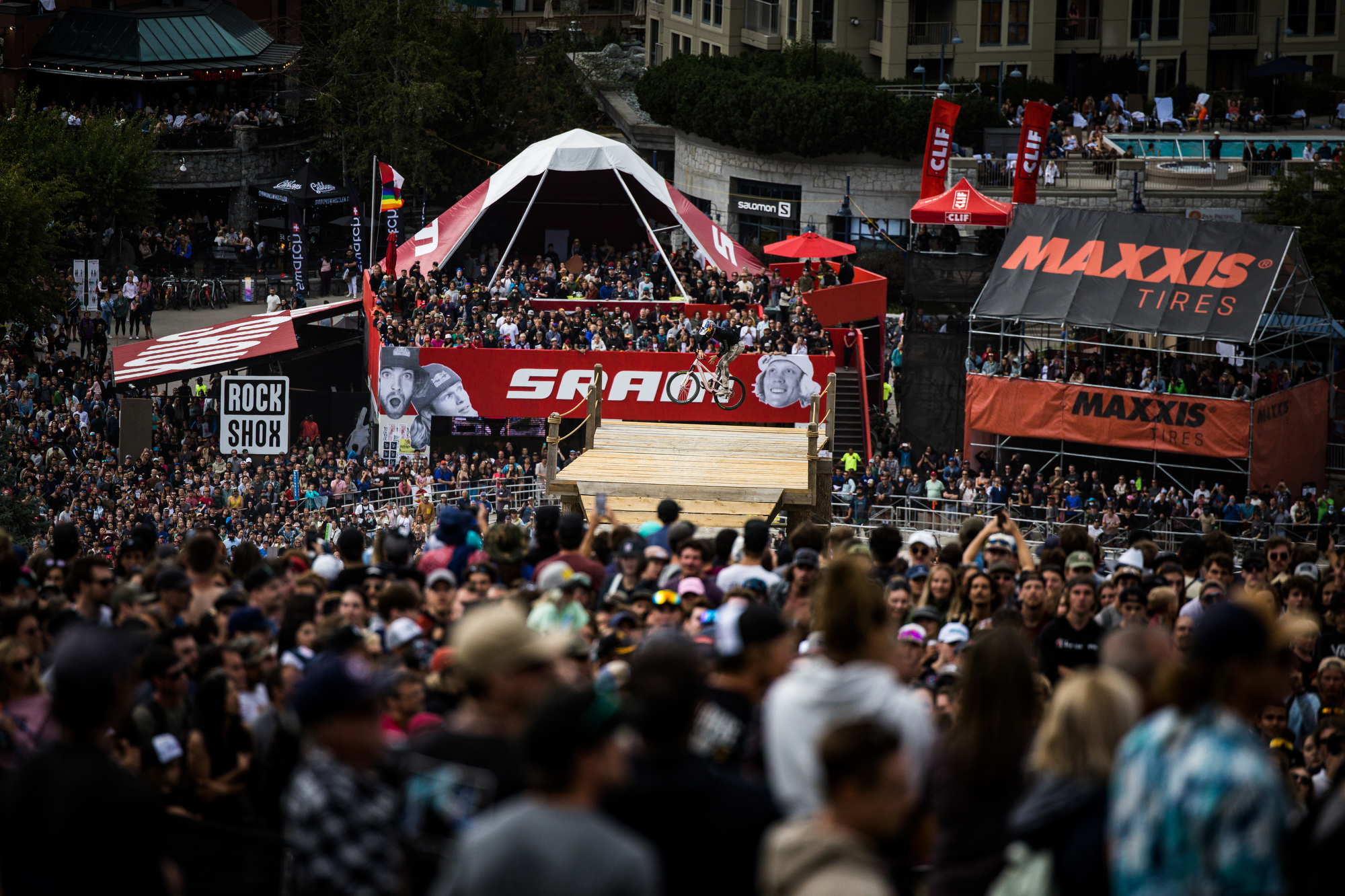 Shot of Emil jumping in front of Maxxis and SRAM booth