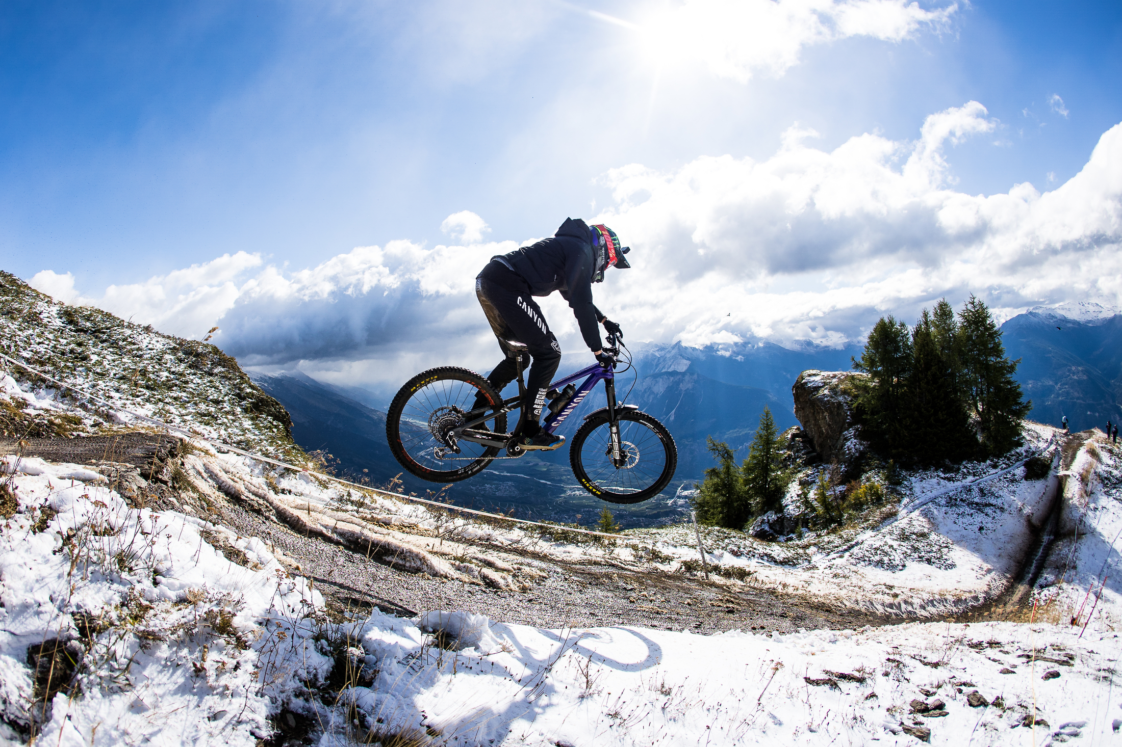 Jack Moir jumping with a snowy back drop