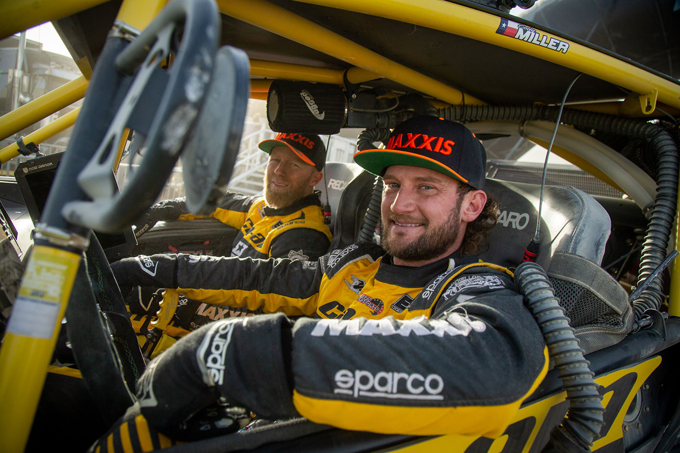 Cody Miller and co-driver smiling before the big race