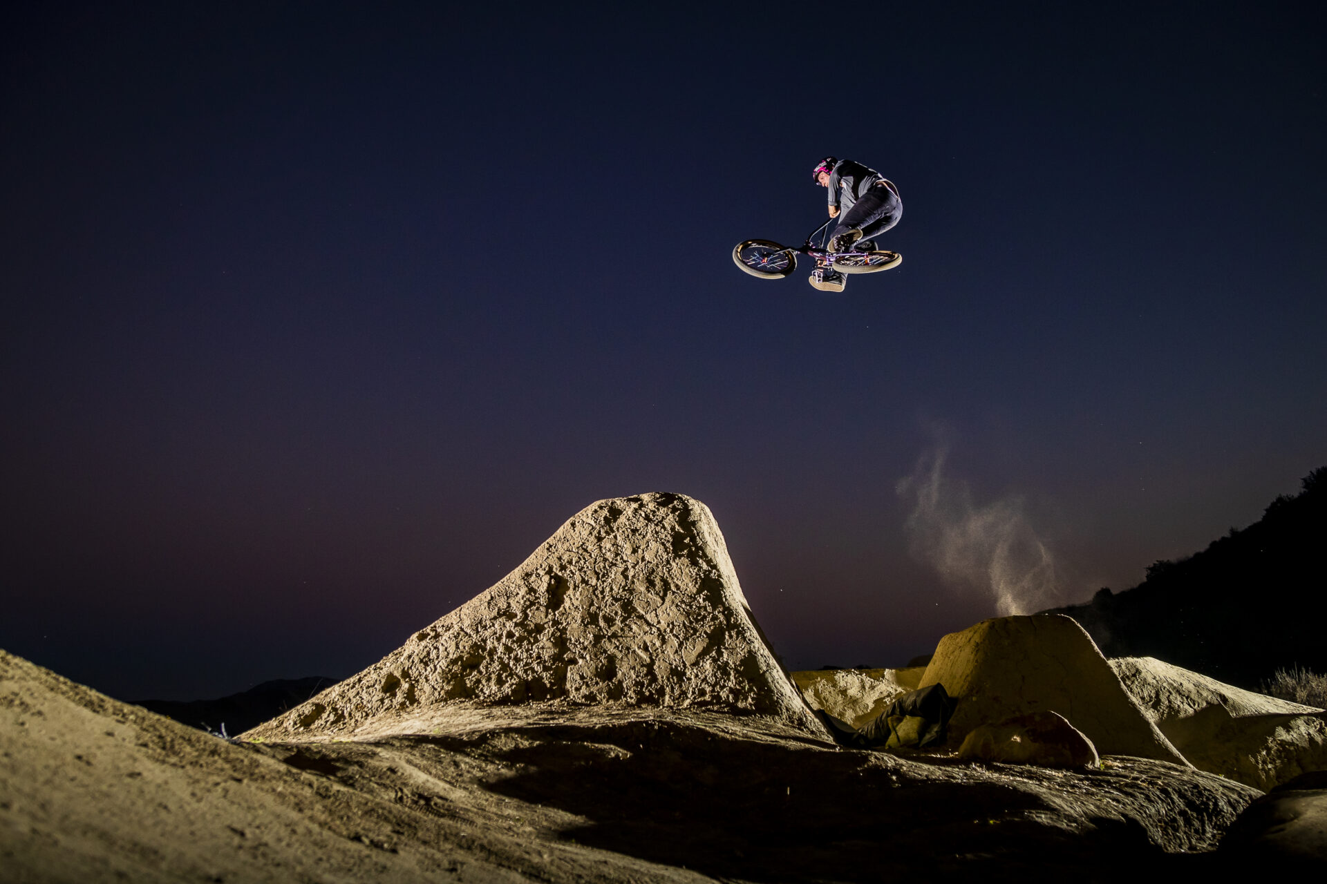 Anthony Napo boosting a jump in the night
