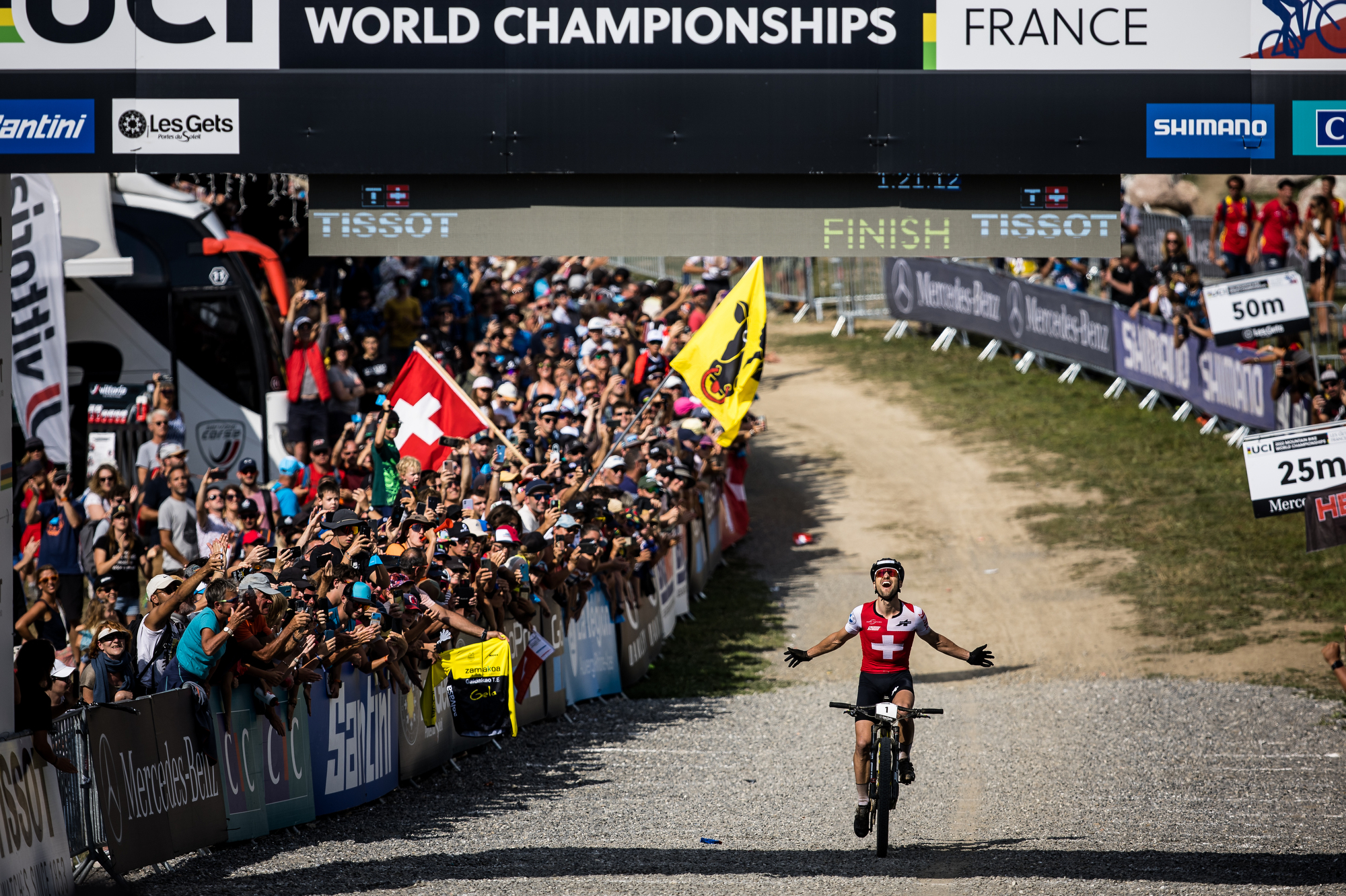 Nino celebrating a win under the finish