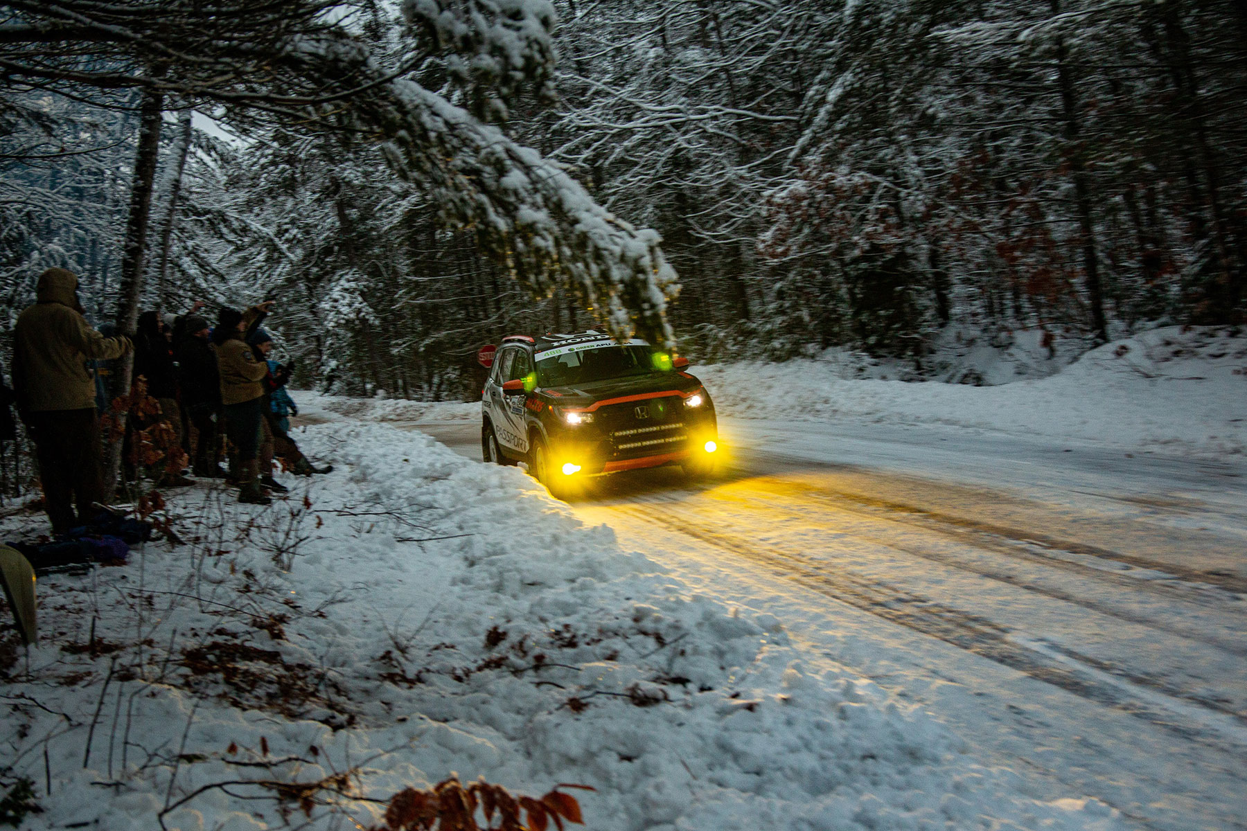 SUV racing on a dark icy road