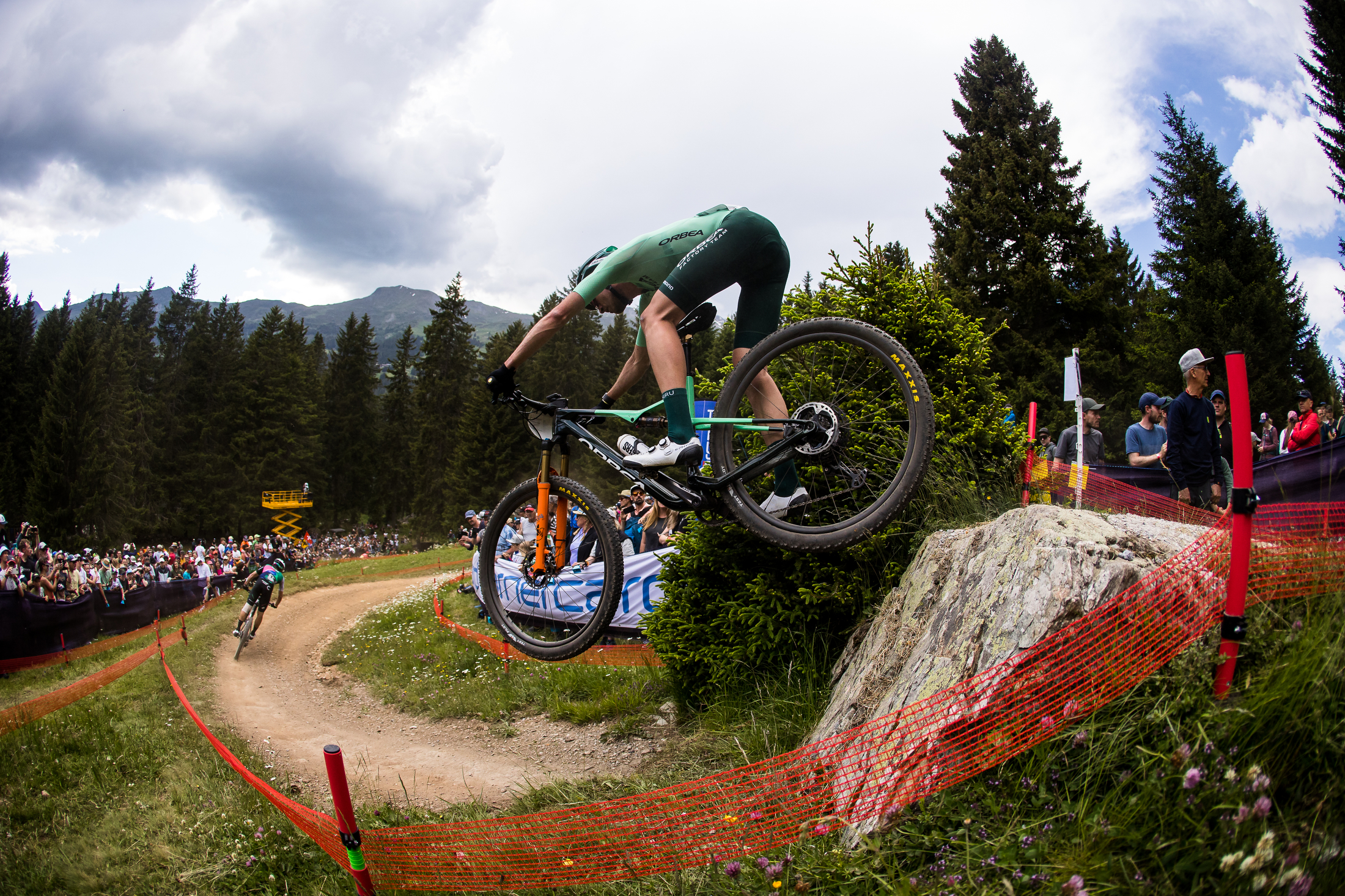 Orbea rider hitting the XC course drop