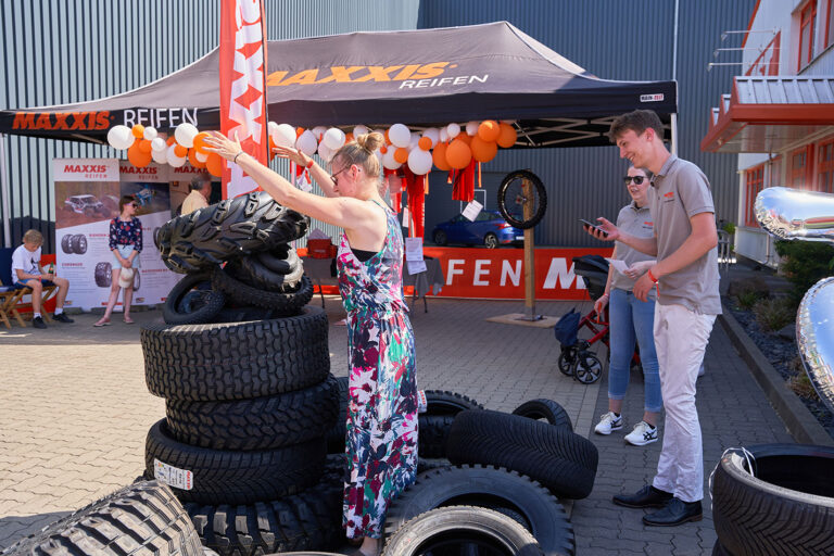 Woman playing a tire stacking game.