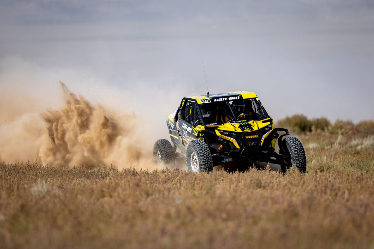 Maxxis rider Dustin “Battle Axe” Jones racing off-road in his CAN-AM UTV vehicle outfitted with Maxxis RAZR XT tires racing action shot