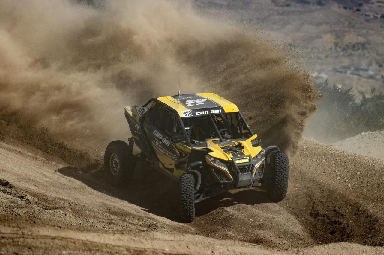 Maxxis rider Dustin “Battle Axe” Jones racing off-road in his CAN-AM UTV vehicle outfitted with Maxxis RAZR XT tires