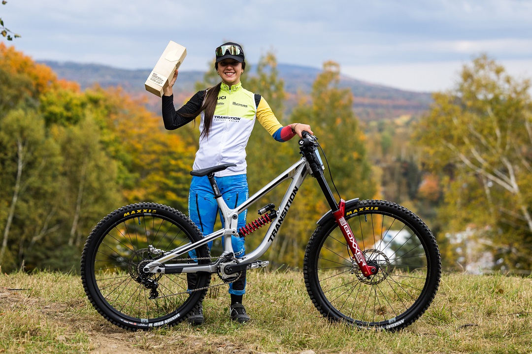 Valentina posing with her bike and trophy