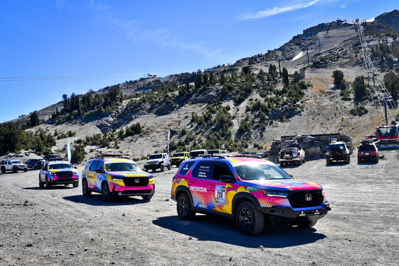 3 vehicle group image of Team #208, Team #211 and Team #212 outfitted with Maxxis’ flagship all-terrain Maxxis RAZR AT tires on dirt road in off-road terrain with mountains in the background.