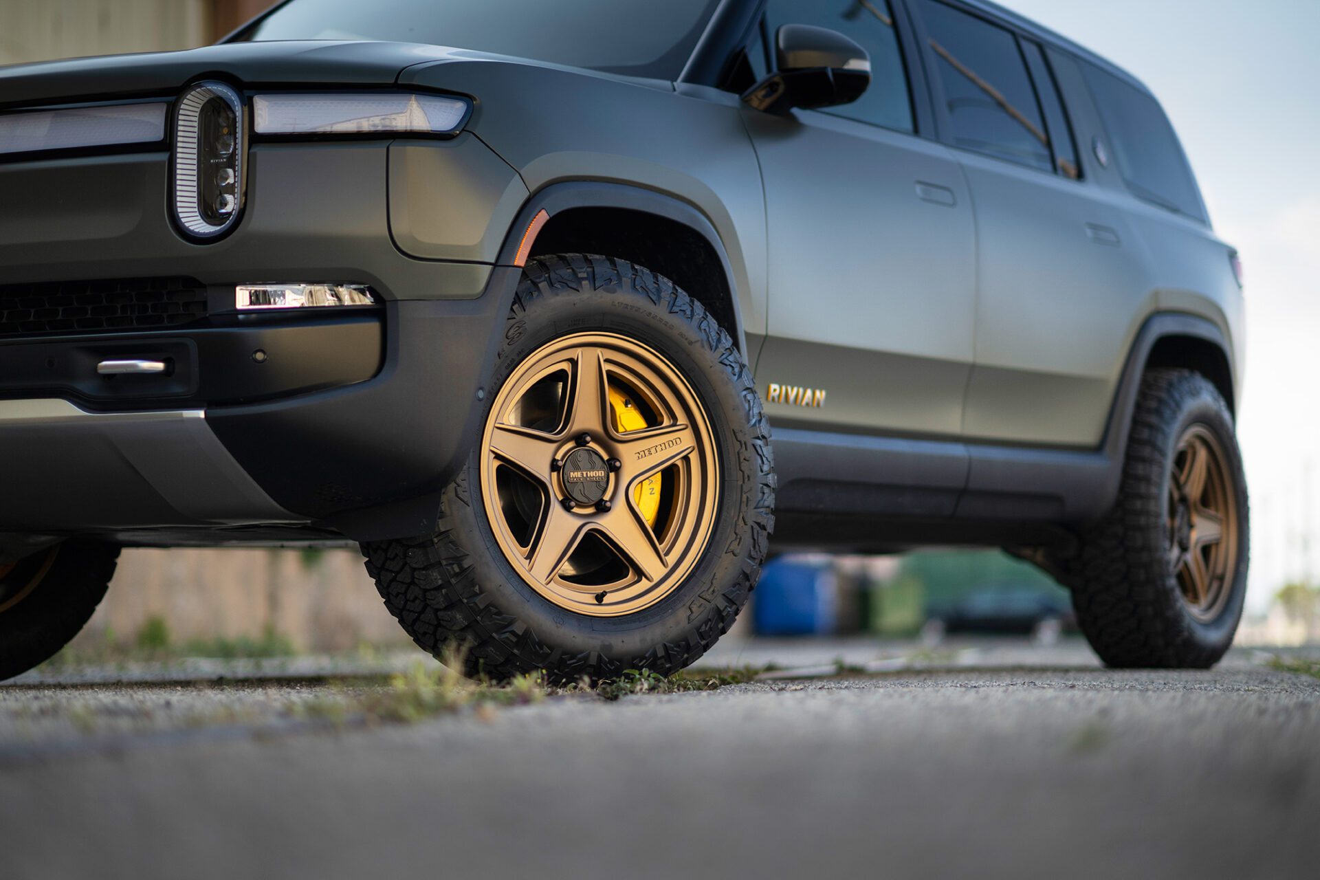 Rivian SUV with Maxxis RAZR AT tires.