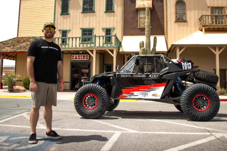 Ian Kennedy standing next to his SxS.