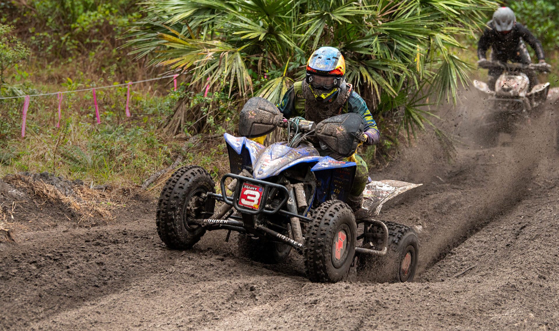 Hunter Hart riding his ATV through the woods
