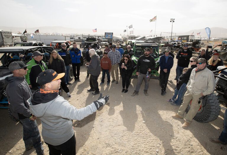 Jeremy talking to a group of people outside