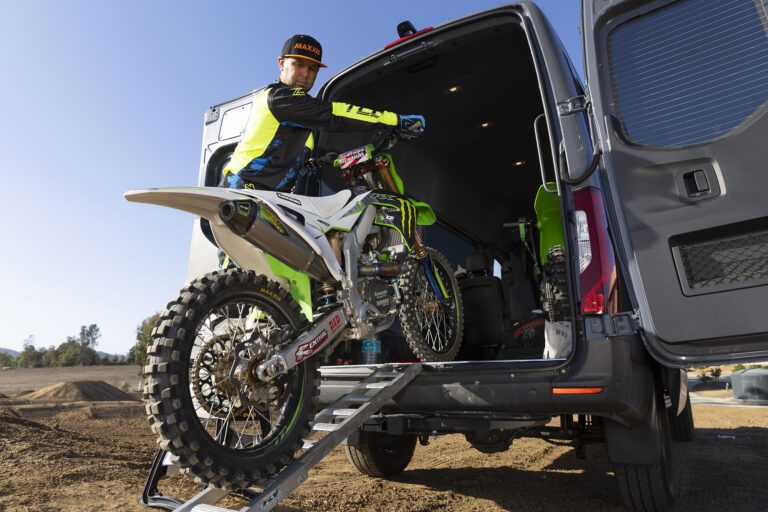 Jeremy pushing his motocross bike into the back of his van