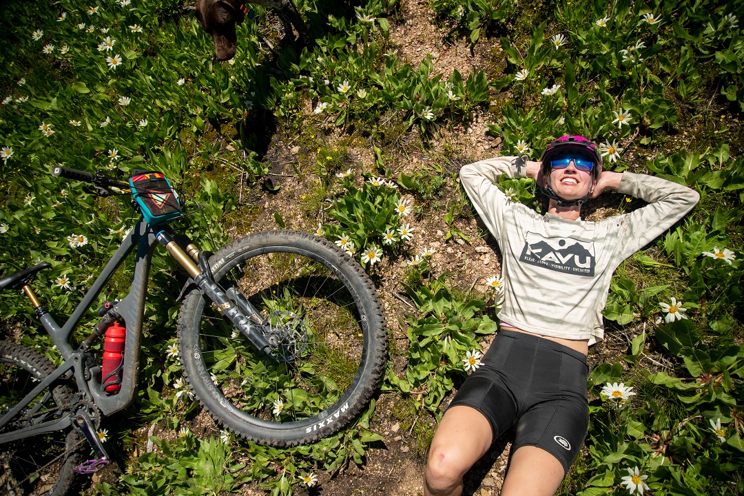 Rider basking in the sun with her bike
