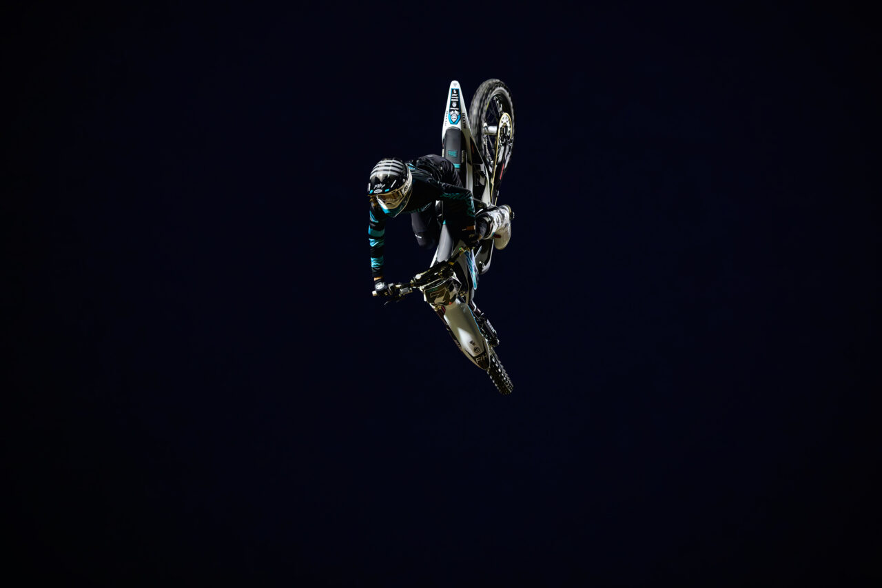 Patrick Evans mid flight in the night sky.