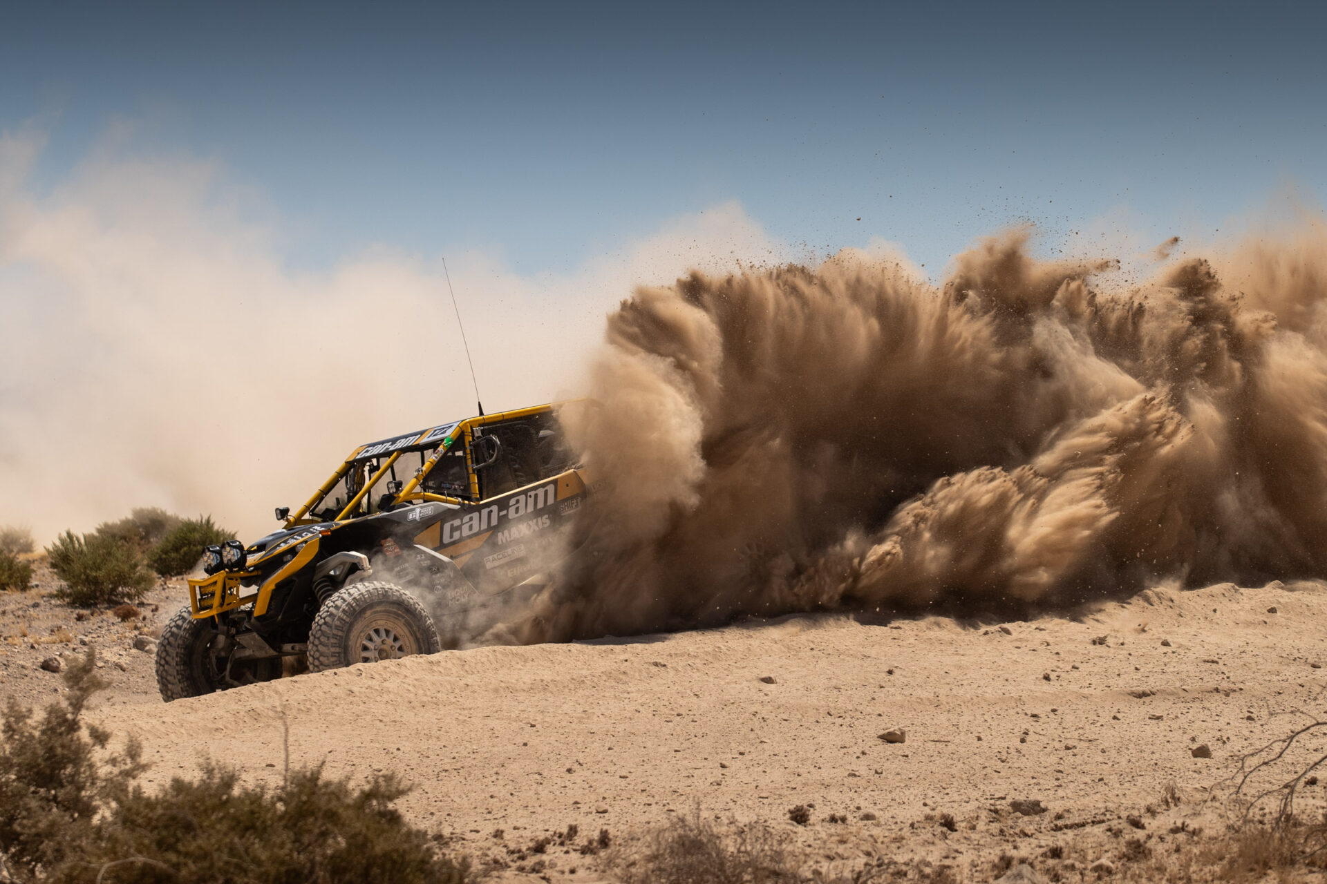 Maxxis utv with a dust cloud to follow