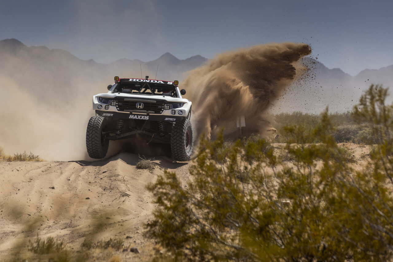 Trick truck getting some air in the desert