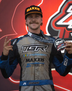 Maxxis athlete on the podium following a race.
