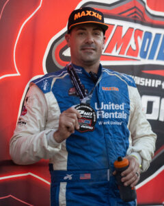 Maxxis athlete on the podium following a race.
