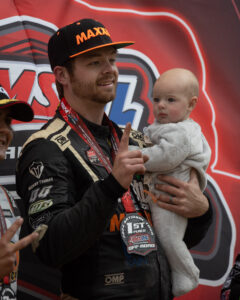 Maxxis athlete on the podium following a race.