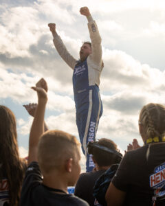 Maxxis athlete celebrating after a race.