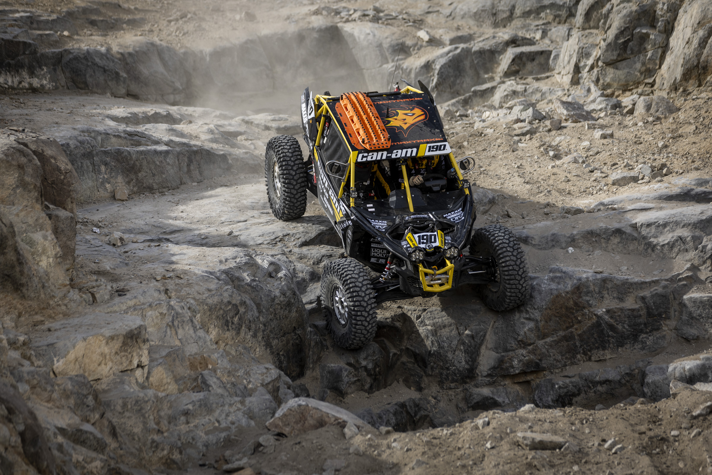 a SxS easing over the edge of the famous rock dropoff name "Back Door"