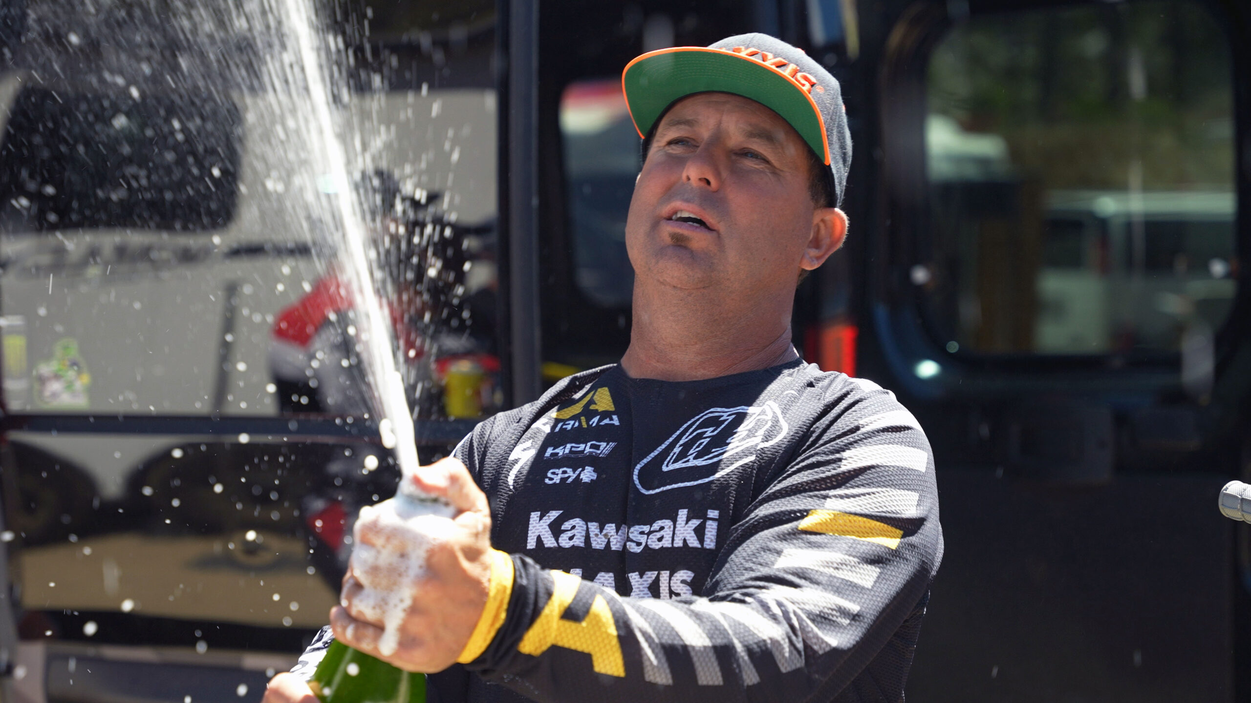 Jeremy McGrath looking like a savvy vet while popping a bottle of champ on the top step of the podium.