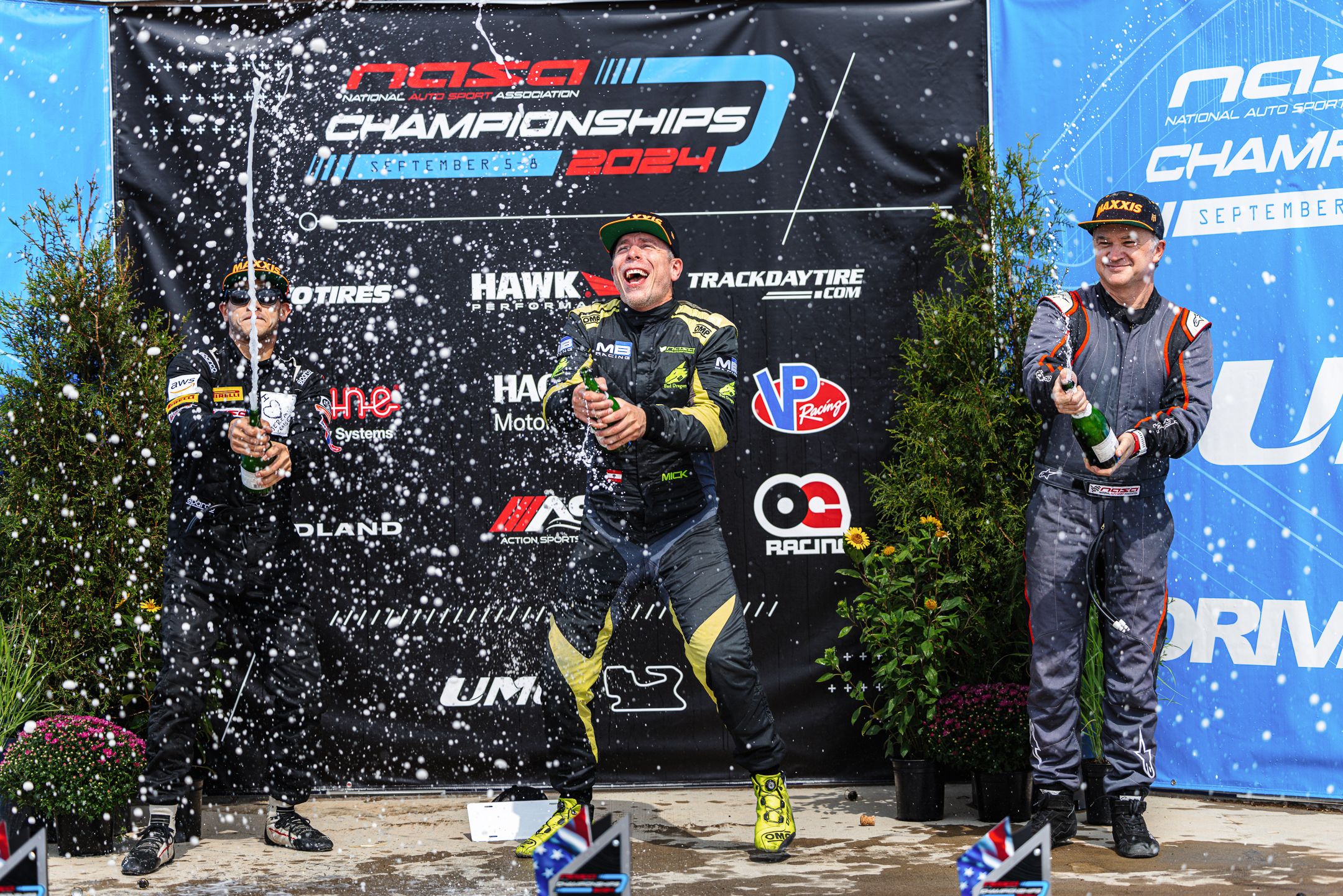 NASA athletes celebrating on the podium.