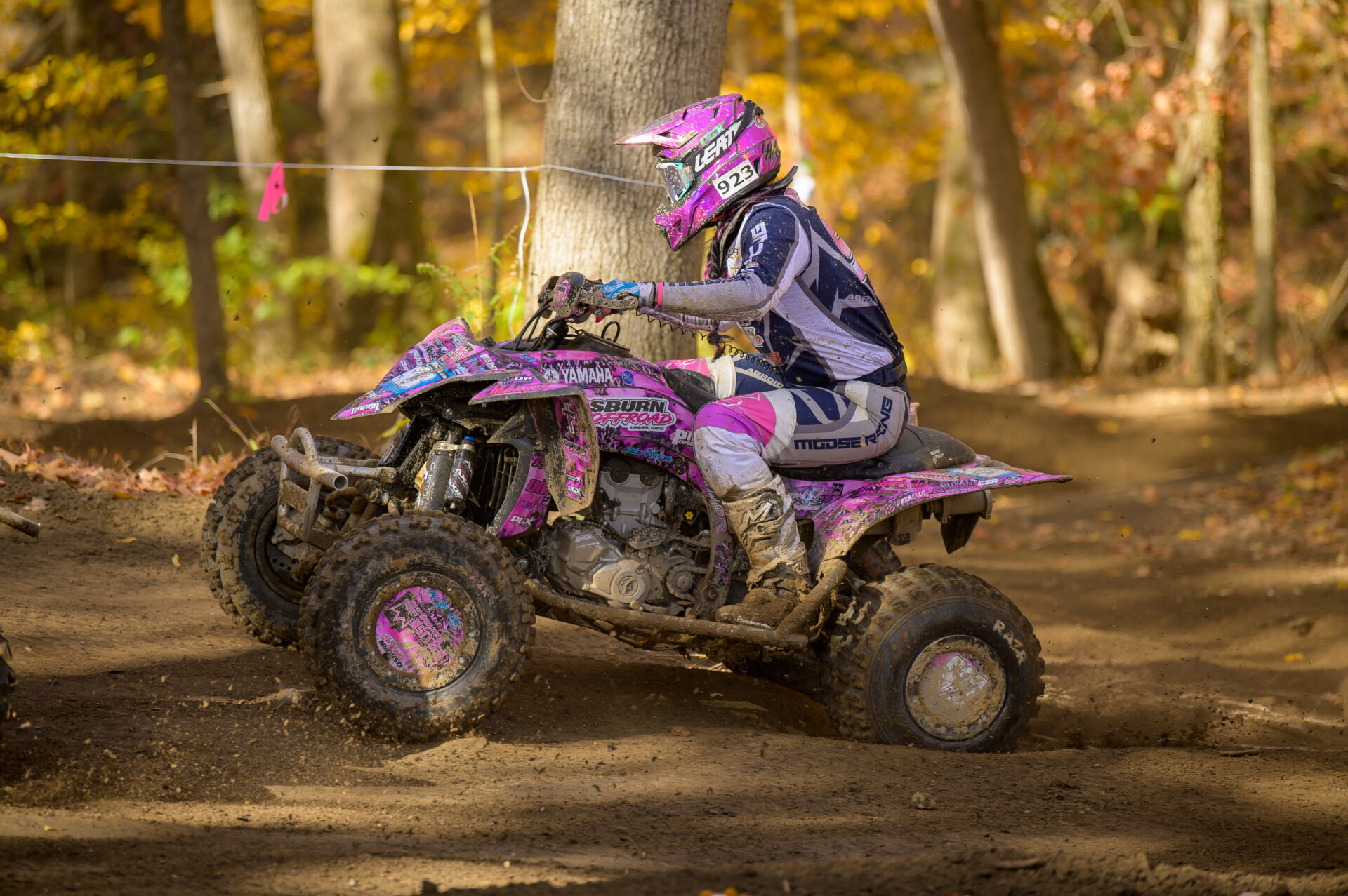 Chloe Harper racing through the woods at Ironman MX