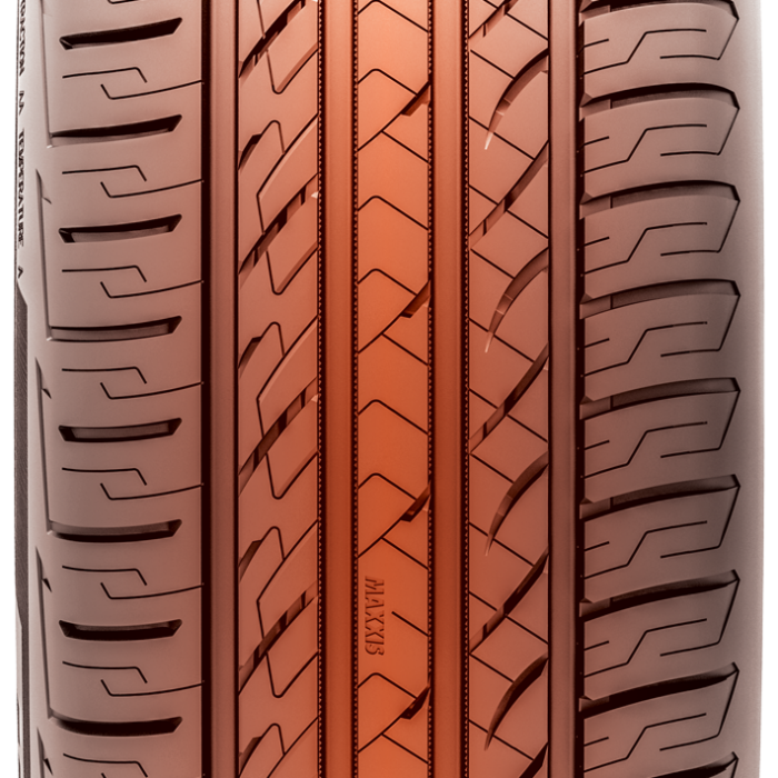 Tight tread shot of a tire with orange colored tread.