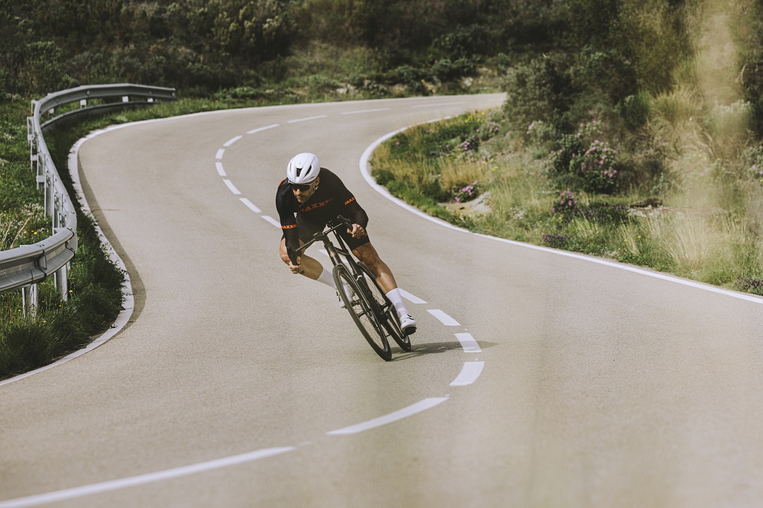 Rider cornering on road bike