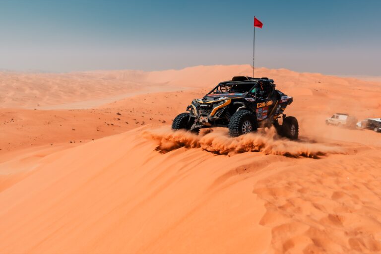 Hunter Miller Racing through the Saudi Arabian Desert in his yellow and black Factory Can-Am fitted with Maxxis Roxxzilla tires at the 2025 Dakar Rally.