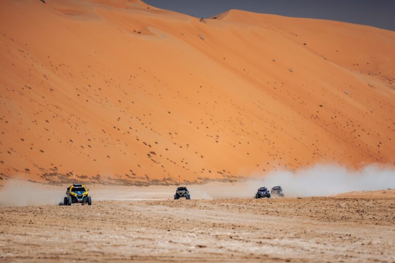 Hunter Miller Racing through the Saudi Arabian Desert in his yellow and black Factory Can-Am fitted with Maxxis Roxxzilla tires at the 2025 Dakar Rally.