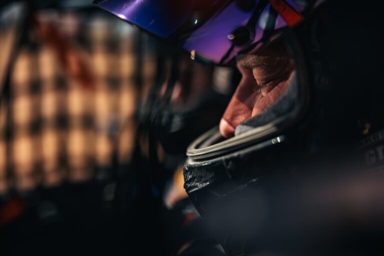Tight profile shot of Hunter Miller inside his Race Helmet with visor up