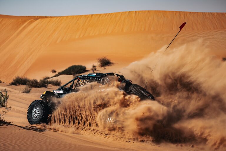 Hunter Miller Racing through the Saudi Arabian Desert in his yellow and black Factory Can-Am fitted with Maxxis Roxxzilla tires at the 2025 Dakar Rally.
