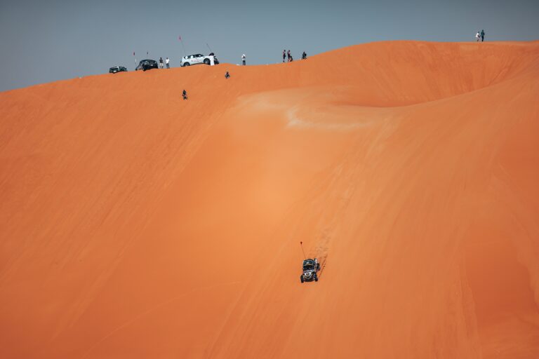 Hunter Miller Racing through the Saudi Arabian Desert in his yellow and black Factory Can-Am fitted with Maxxis Roxxzilla tires at the 2025 Dakar Rally.