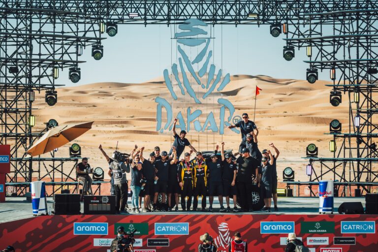 The Factory CanAm team on the Dakar Rally podium after Hunter Miller's top ten finish.