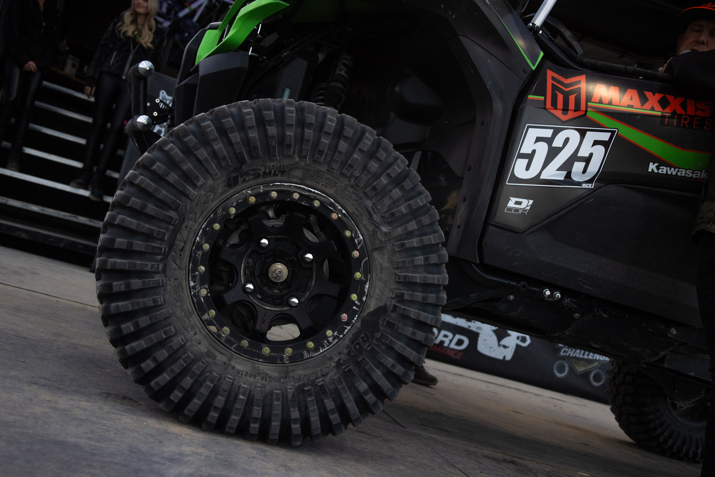 A tight crop of a Maxxis Roxxzill on Jeremy McGrath's #525 race car while it rests on the podium.