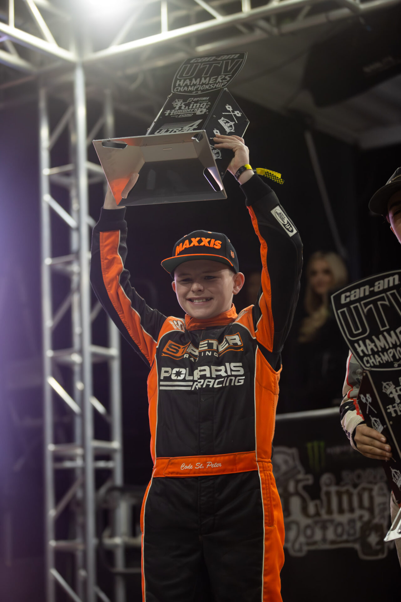 A Maxxis sponsored youth driver celebrating on the KOH podium.