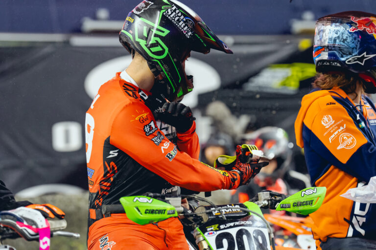 ISRT's Logan Leitzel sitting on his green race bike clean and ready to race.