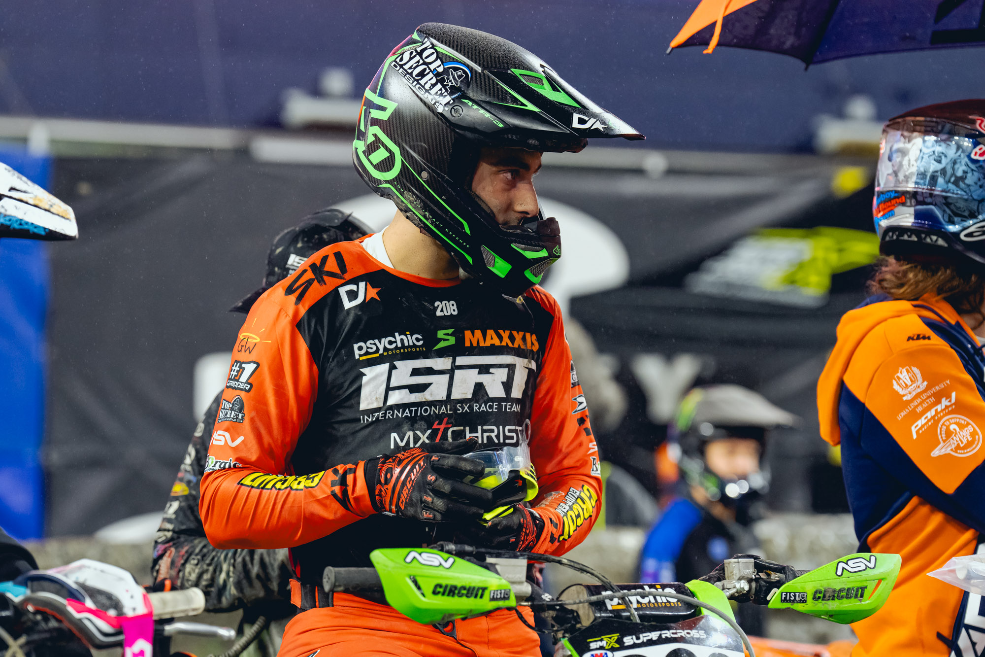 ISRT's Logan Leitzel sitting on his green race bike clean and ready to race. 