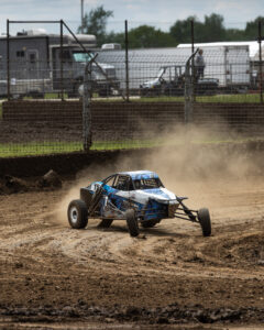 Maxxis athlete at CHAMP offroad, sliding through dirt